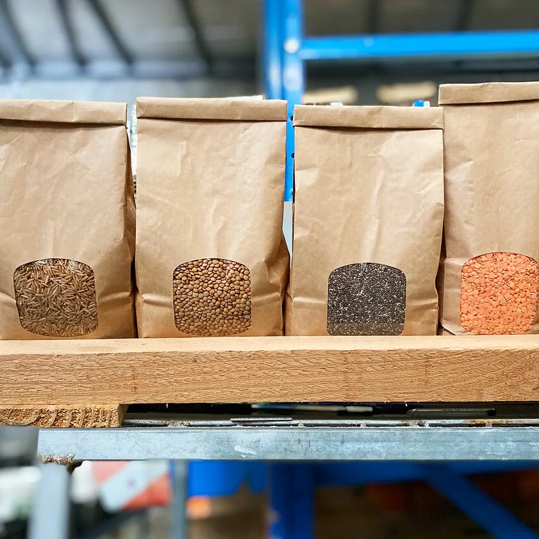 Bulk pantry staples lined up on a warehouse shelf