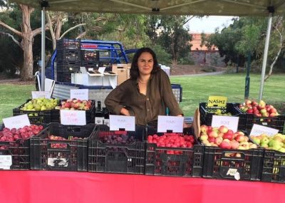 Zara Hazeldean selling Gippsland grown Hazeldean Forest Farm organic apples, pears and plums.