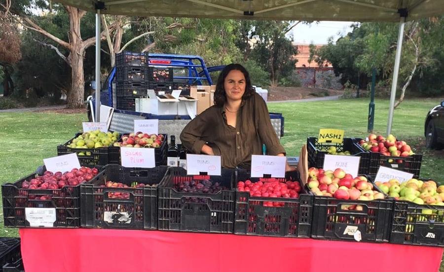 Zara Hazeldean selling Gippsland grown Hazeldean Forest Farm organic apples, pears and plums.