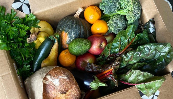 An open box on a doorstep, delivered by CERES Fair Food